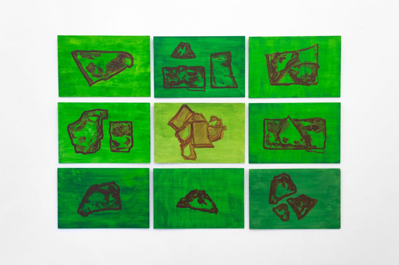 A series of 9 rectangular vivid green paintings on wooden board. Each painting uses thin fluid washes of vibrant green, with geometric patterns like rock formations painted in thin washes of brown.