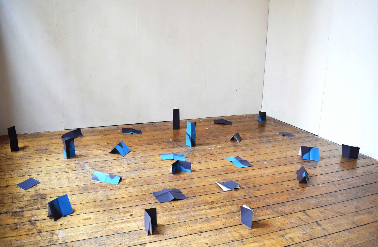 I in Black, in Blue Installation into space of an A6 book made up of 24 folded A4 inkjet printed pages, unbound