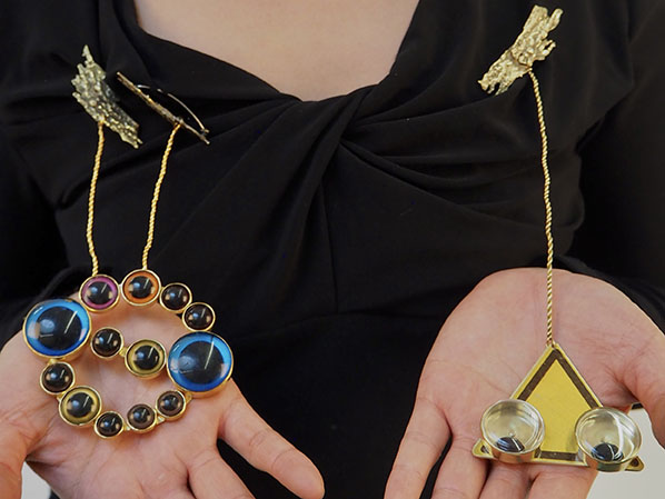 Two brooches aim to control the audience's action subconsciously -- which one do you prefer?