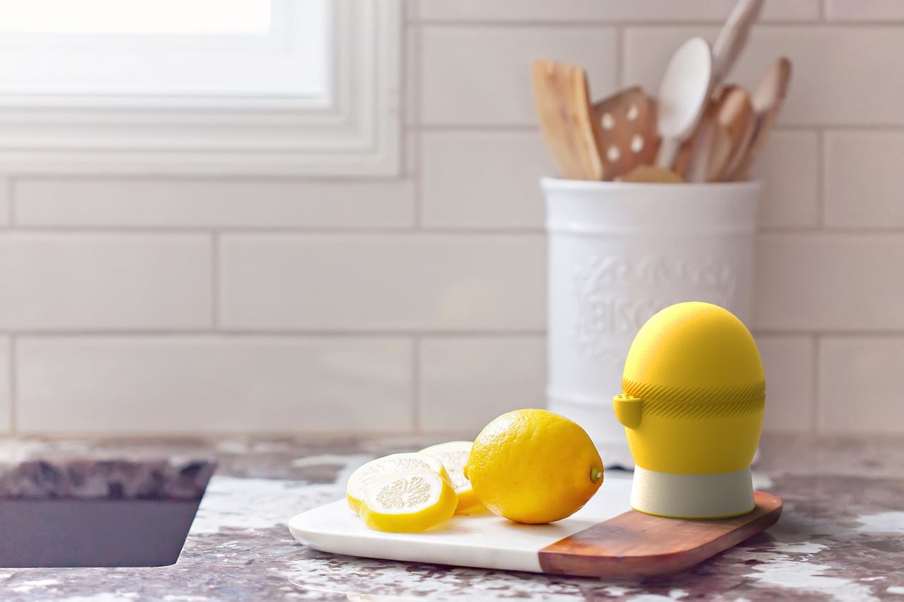 Lemi in a kitchen on chopping board next to lemons.